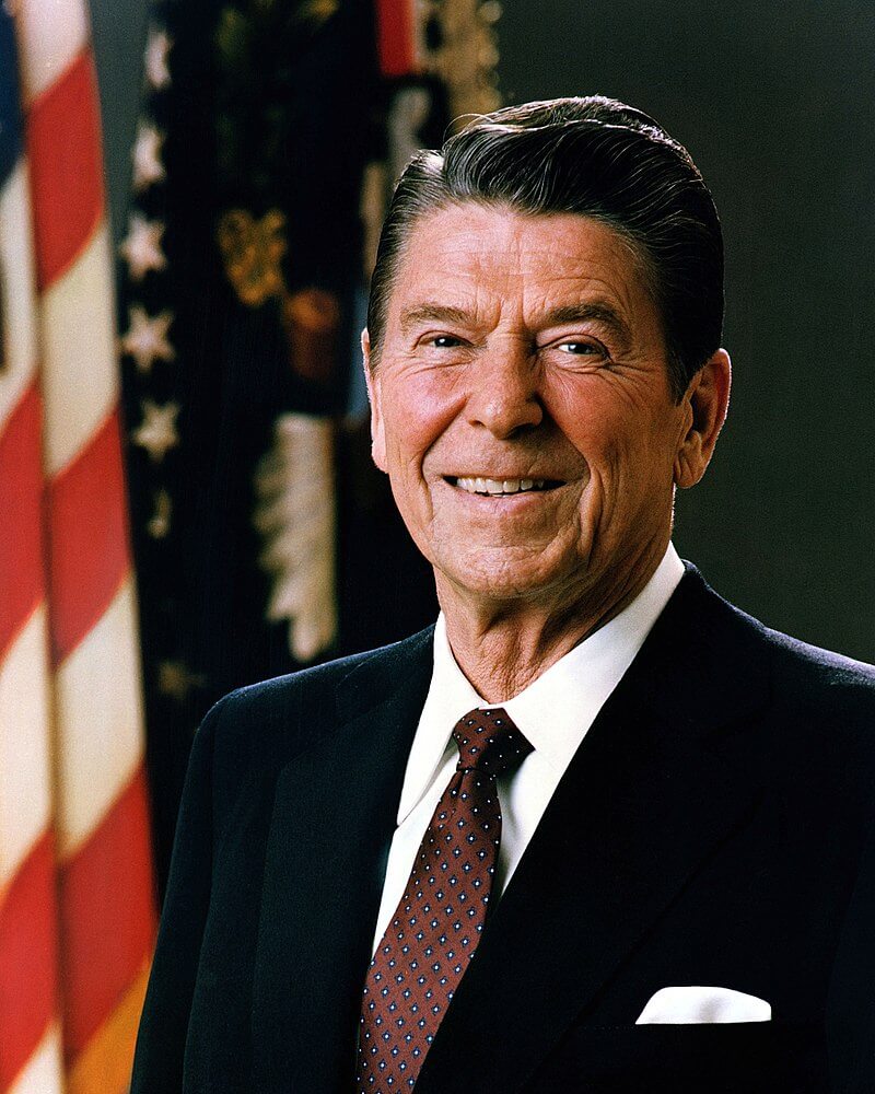 Ronald Reagan in front of an American flag